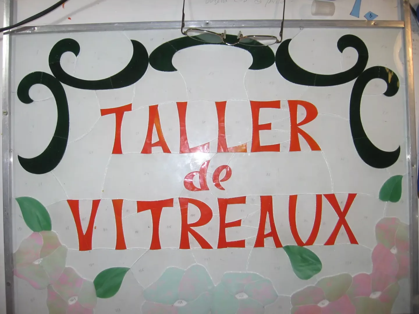 Cartel del taller en vidrio