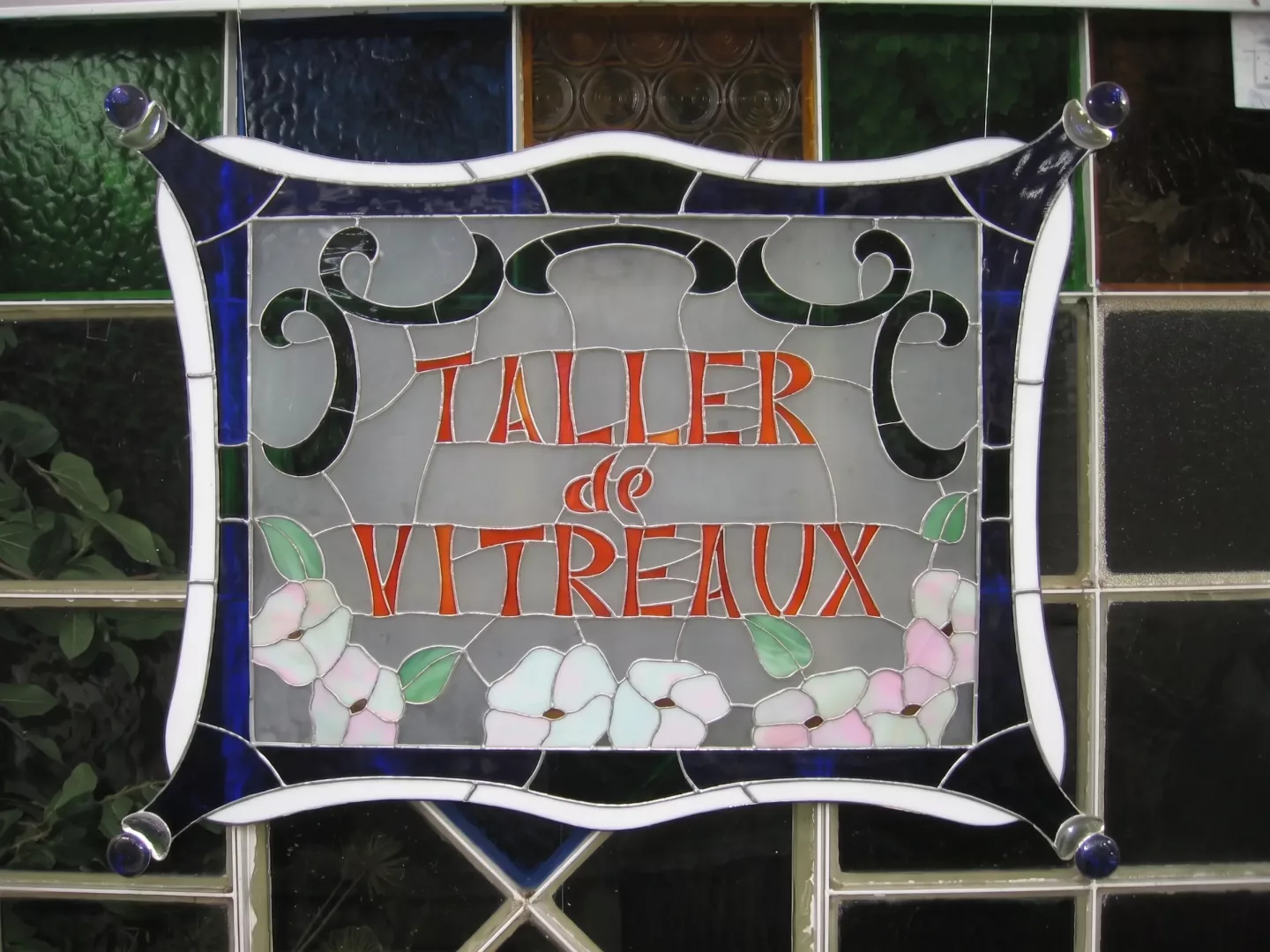Cartel del taller en vidrio