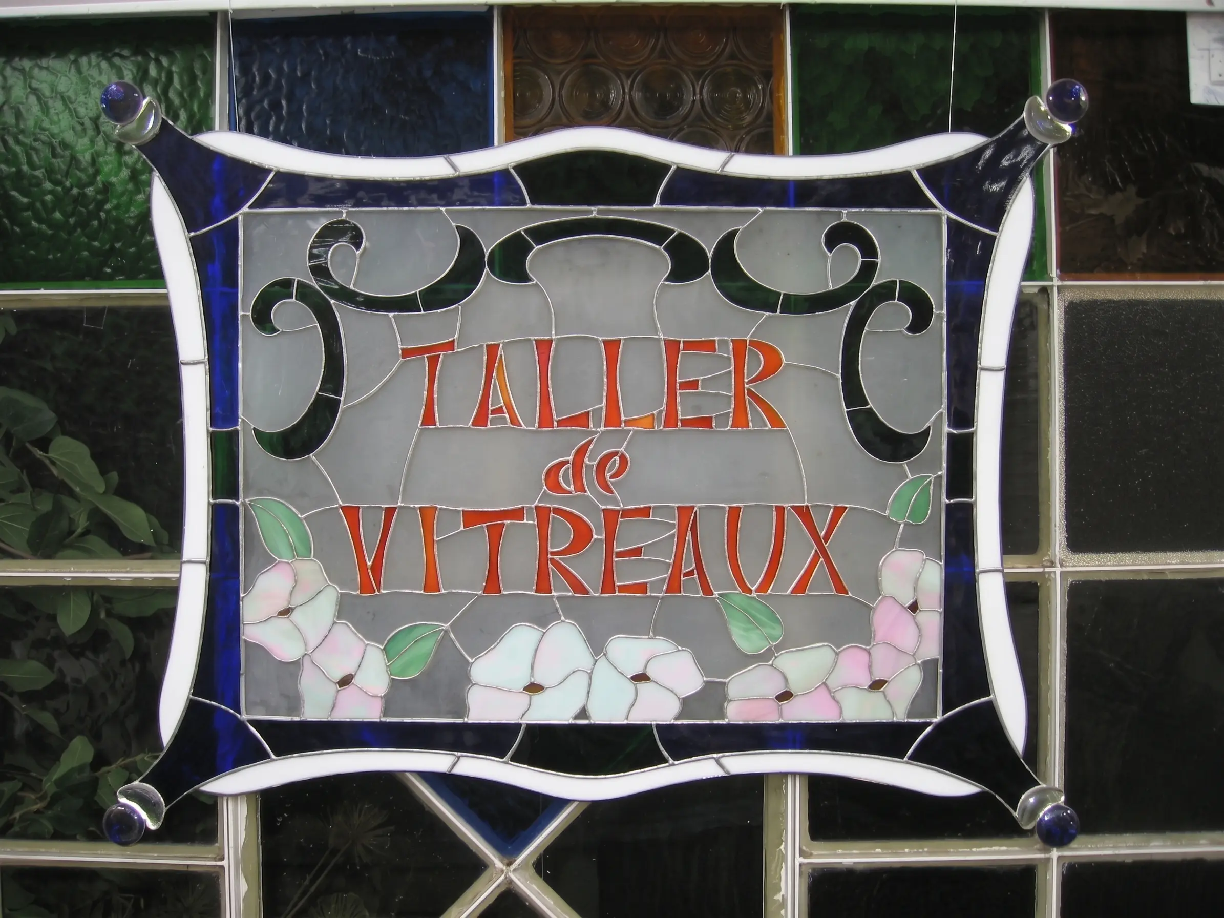 Cartel del taller en vidrio