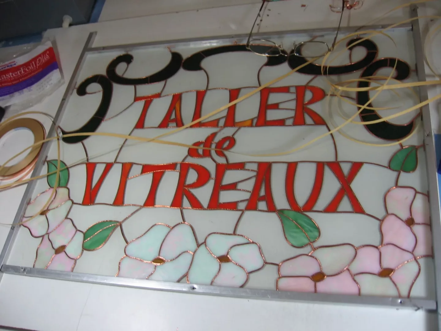 Cartel del taller en vidrio